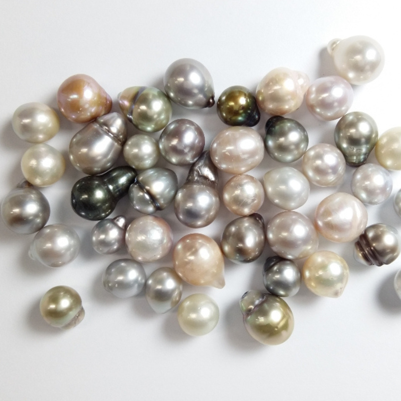 Assorted pearls on a light background