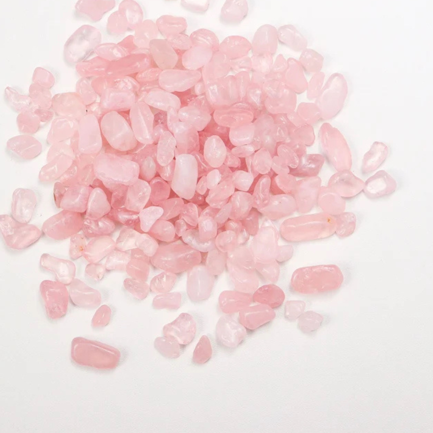 Pink rose quartz loose gem on a white background