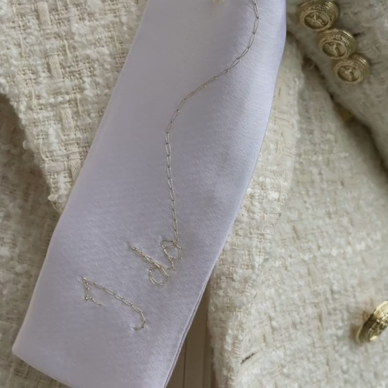 Video close-up with the satin nasya hairband and pearl beads details